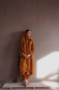 Mustard silk velvet hand embroidered kurta set.