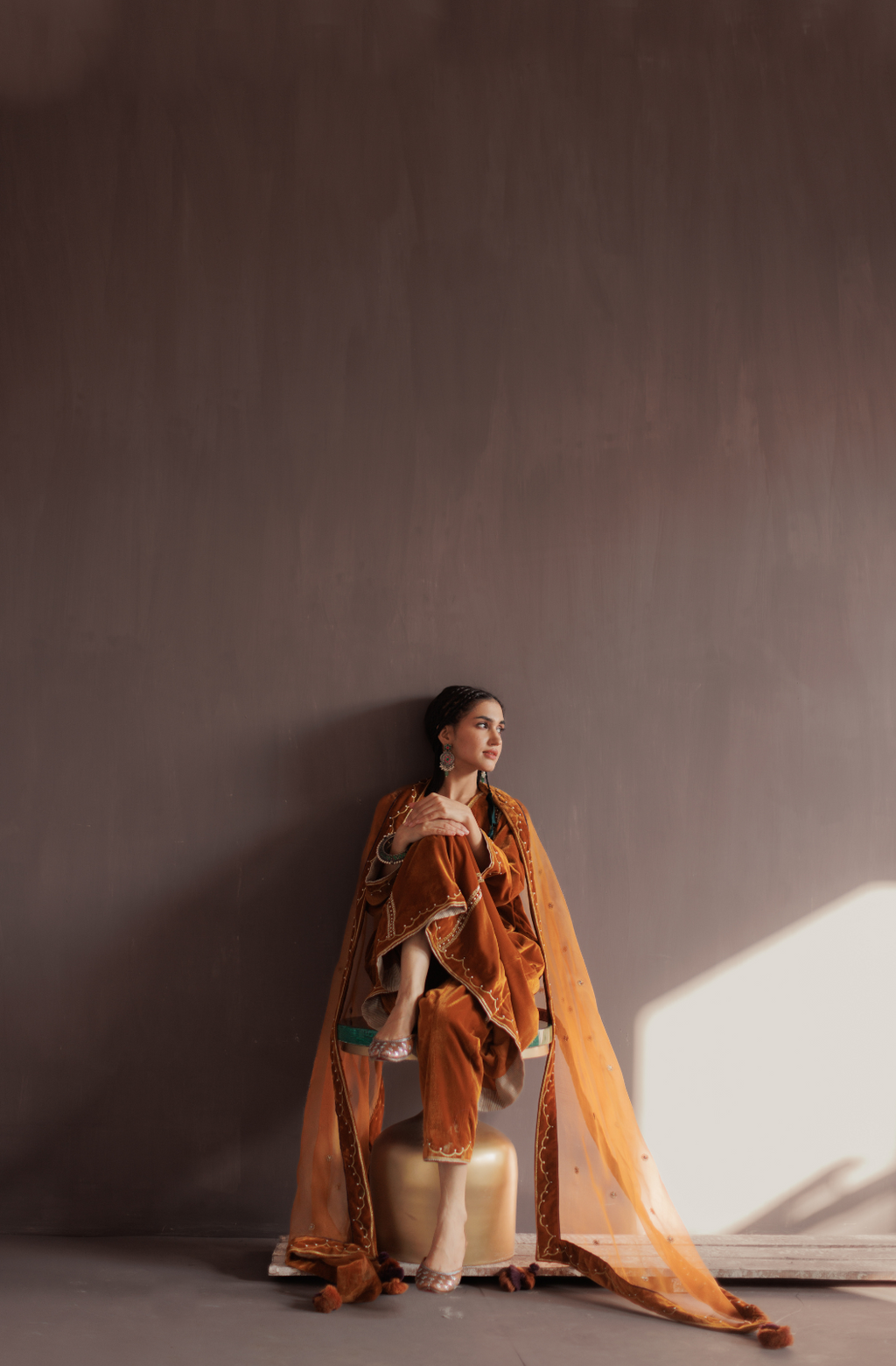 Mustard silk velvet hand embroidered kurta set.