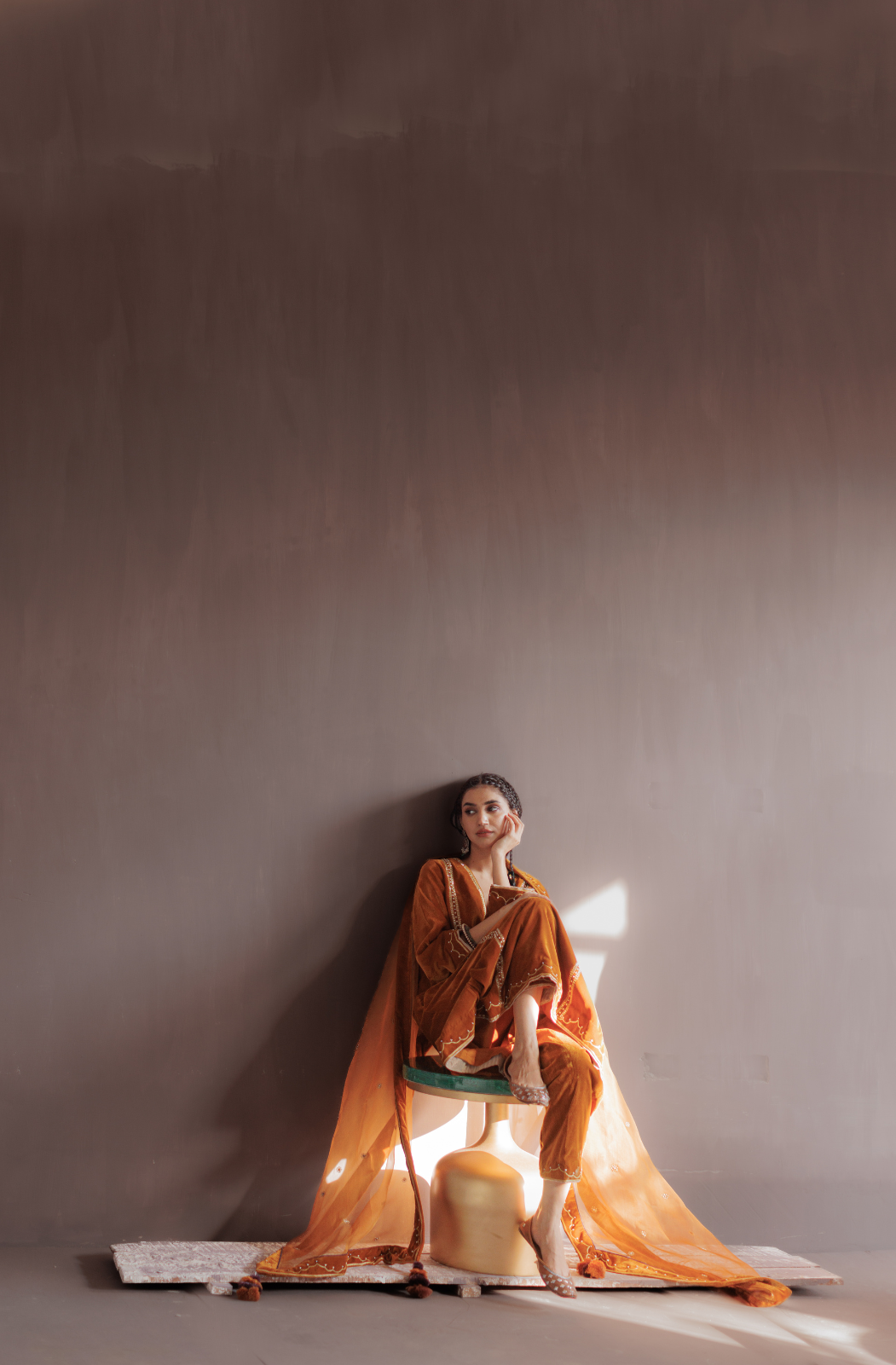 Mustard silk velvet hand embroidered kurta set.