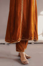Mustard silk velvet hand embroidered kurta set.