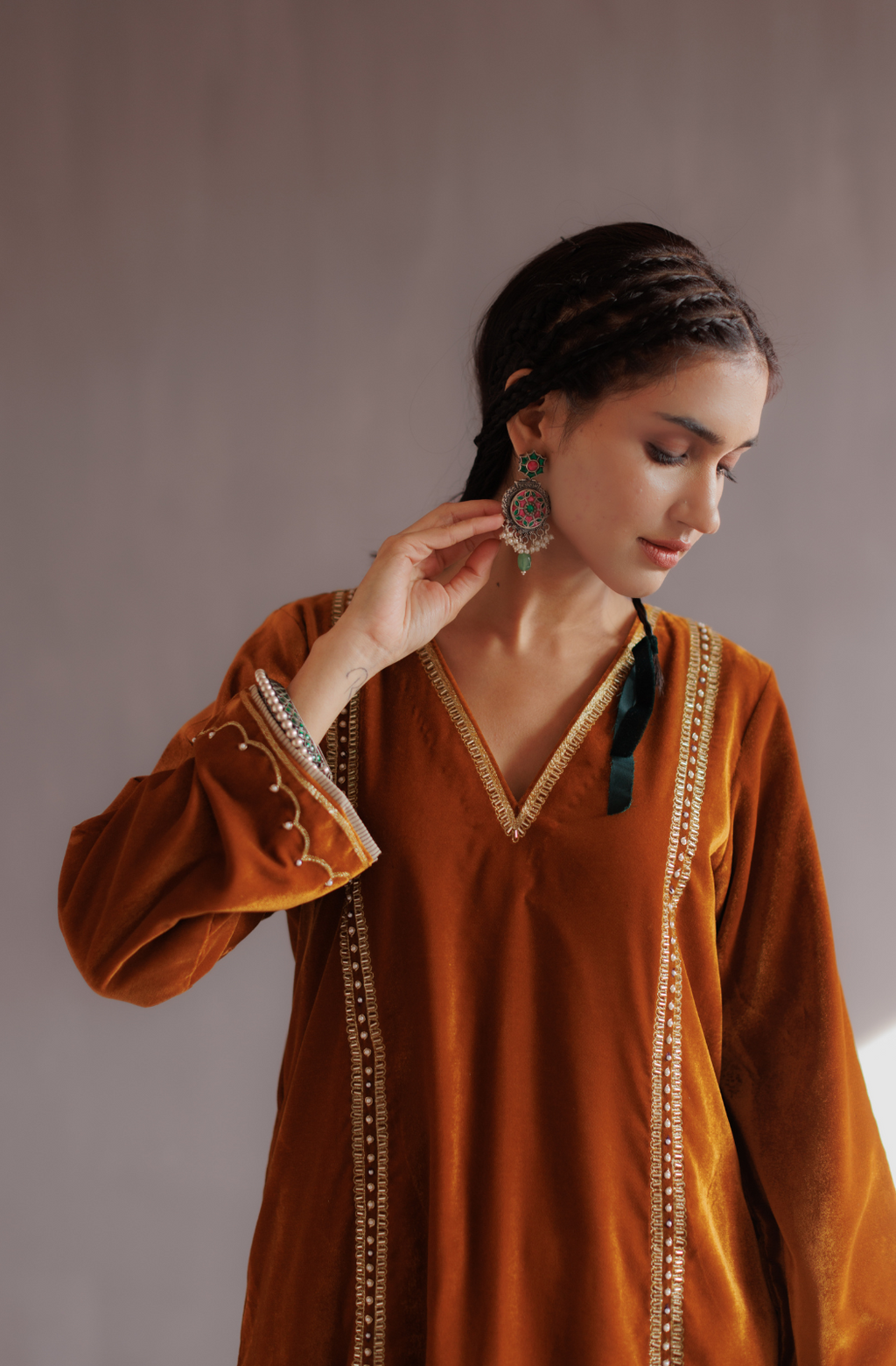 Mustard silk velvet hand embroidered kurta set.